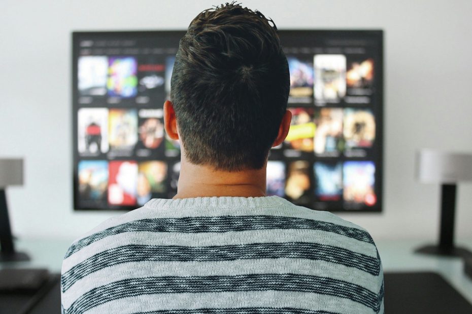 Man checking on streaming shows