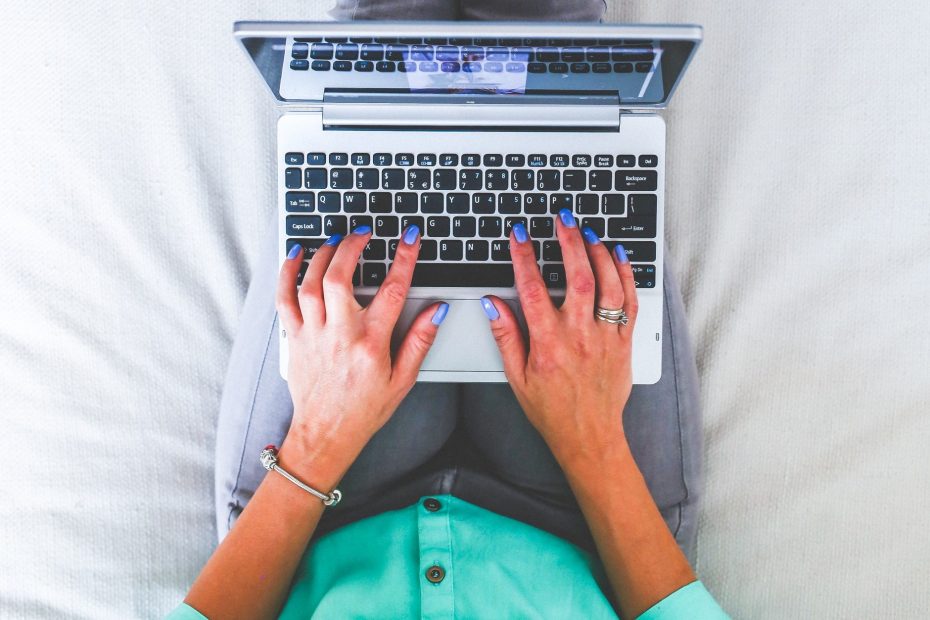 woman transcribing audio recording